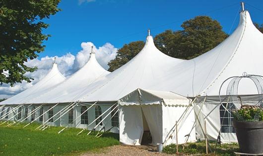 a line of portable restrooms in a shaded area, offering a comfortable experience for users in Browns Mills